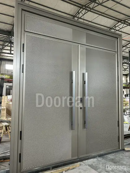 Grey double door with long pull handles, photographed on our floor