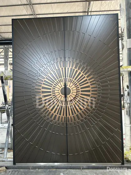 Dark double door with a gold sunburst, photographed on our floor